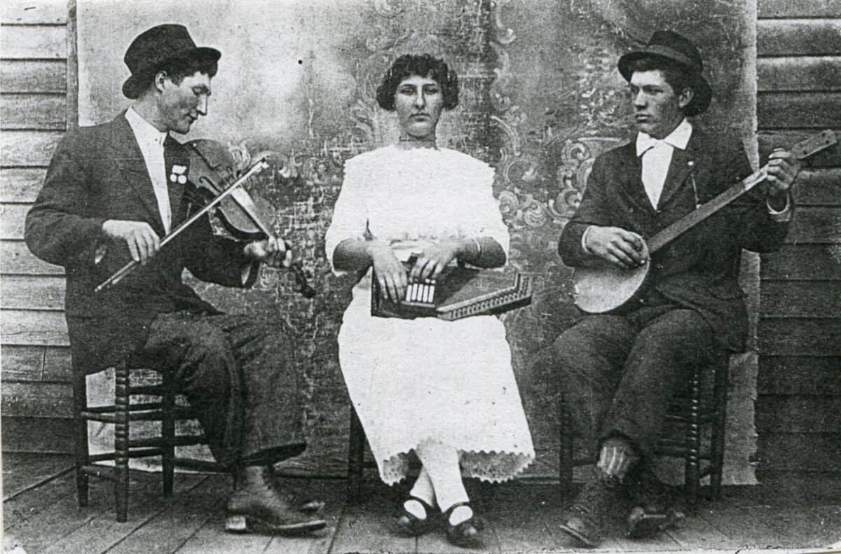 Early photo of Akers family musicians, Harvey Akers (fiddle), Pearl Akers (autoharp), Andrew Akers (banjo)