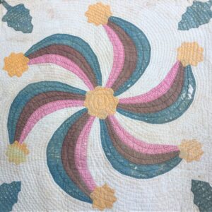 This is one of four swirling pinwheels in this quilt.