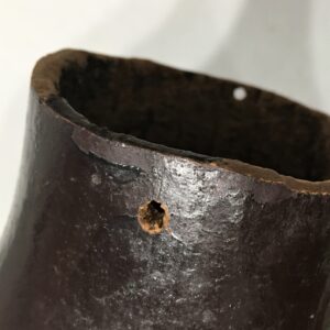 Holes drilled in the top of the gourd vase indicate it was once used with a wire handle.