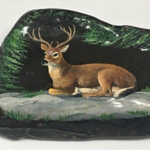 Deer painting following the shape of the rock.