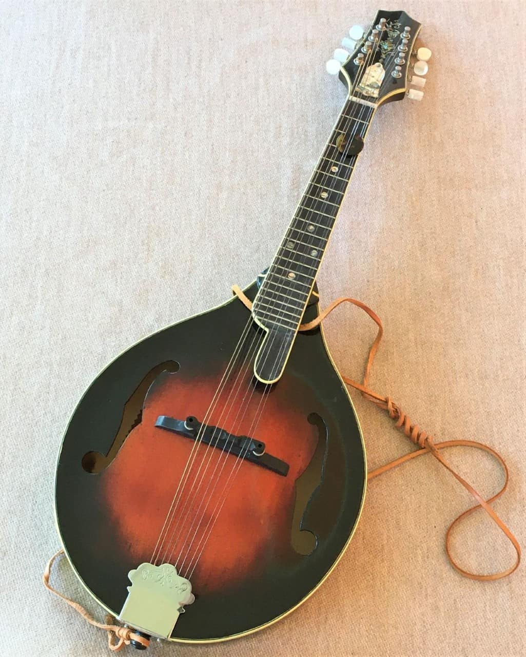 Mandolin with curly maple and mother of pearl.